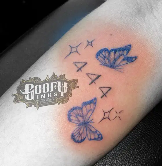 Butterflies with Stars and 444 Arm Tattoo