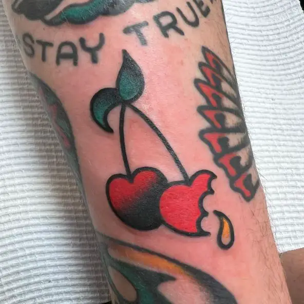 Bitten Cherry Arm Tattoo