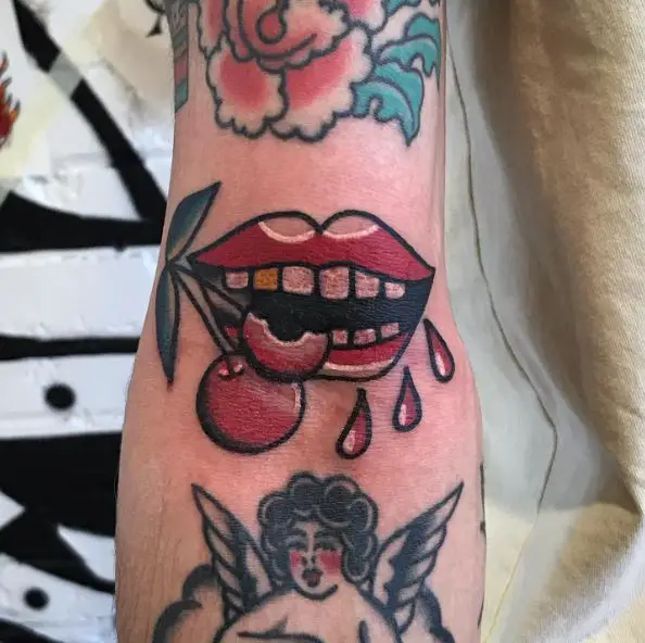 Lips and Bitten Cherry Arm Tattoo