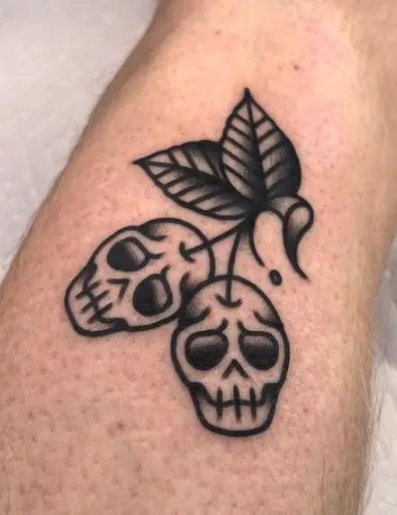 Black and Grey Skull Cherries Tattoo