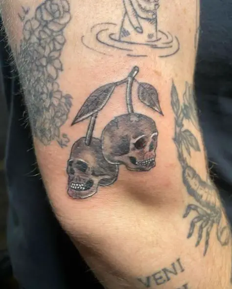 Grey Skull Cherries Elbow Tattoo