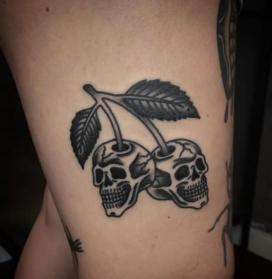 Black Skull Cherries Thigh Tattoo