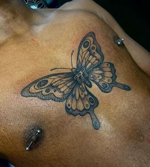 Grey Shaded Butterfly and 777 Chest Tattoo