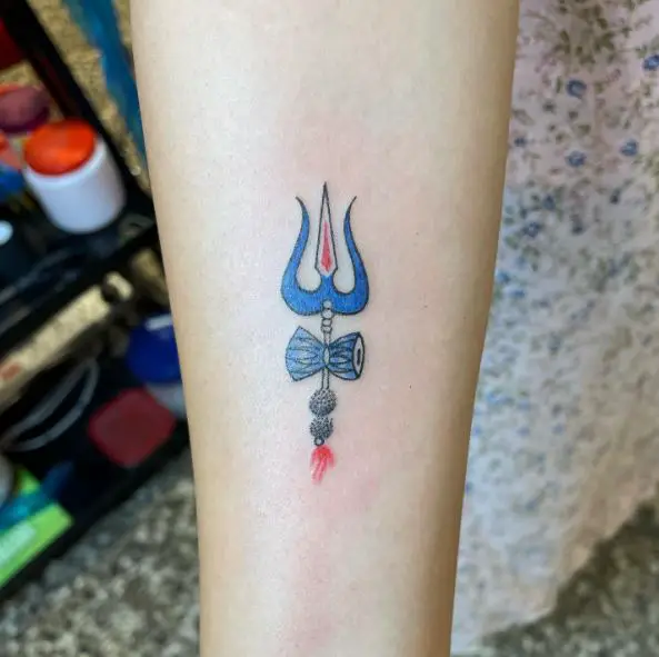 Small Blue Trishul Forearm Tattoo