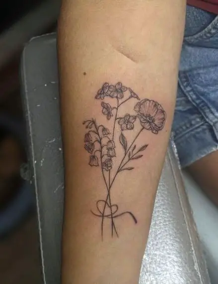 A Dainty Bouquet Tattoo with Meaningful Flowers