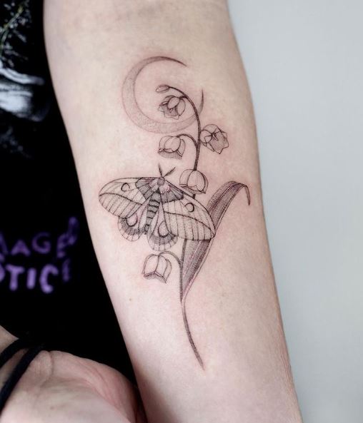 A Moth and Lily of the Valley Tattoo