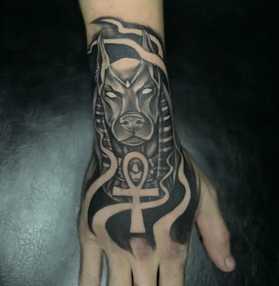 Black Inked Anubis Hand Tattoo