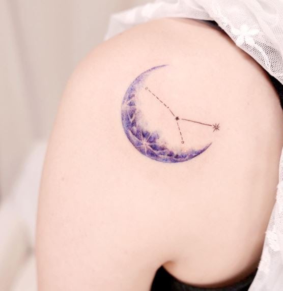 Blue Crescent Moon Tattoo with Dark Tiny Dots
