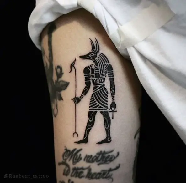 Bold Black Ink Anubis Tattoo