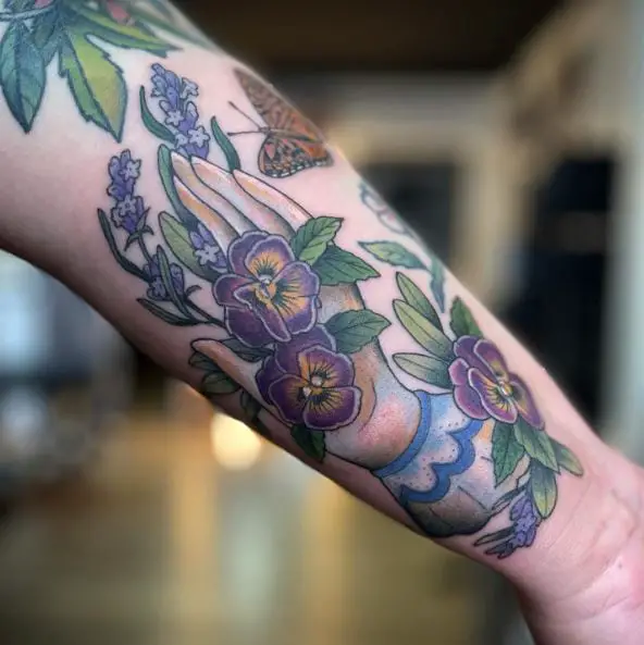 Bunch of Purple Flowers with a Hand Tattoo