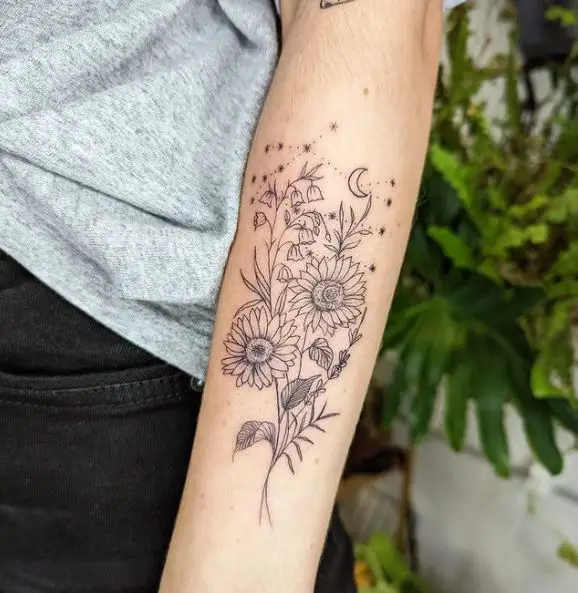 Forearm Tattoo of Sunflower and Lily of the Valley With Sparks and Moon