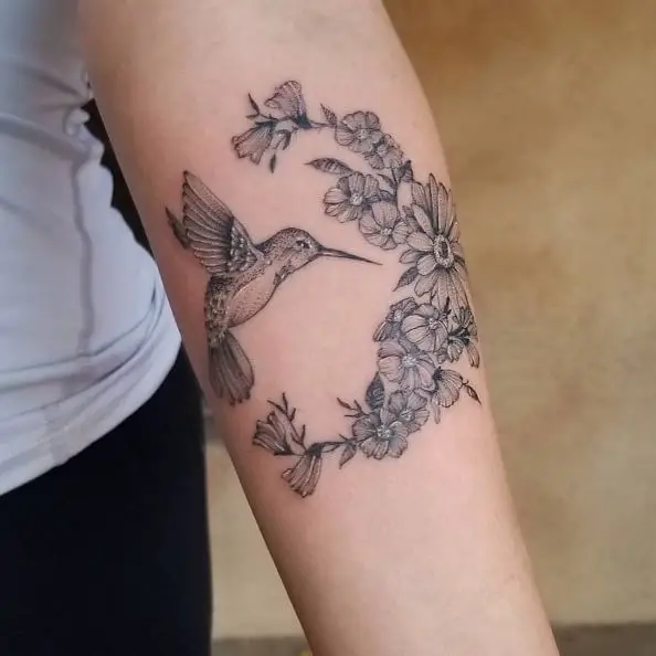 Hummingbird and Crescent Shaped Flowers Tattoo