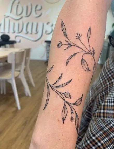 Leaves and Tiny Flowers Vine Tattoo