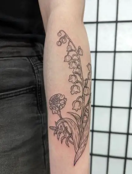 Marigold and Lily of the Valley Forearm Tattoo