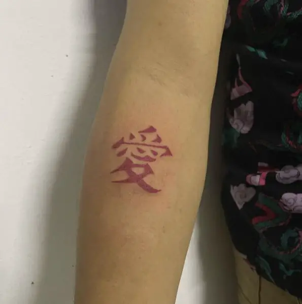Pink Kanji Forearm Tattoo