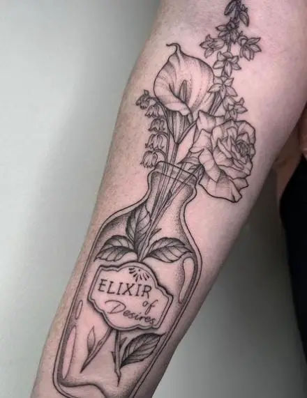 Potion Bottle With Flowers Forearm Tattoo