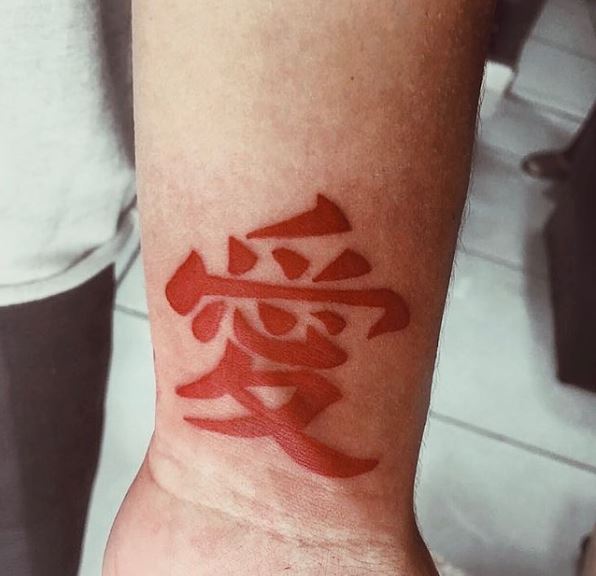 Red Colored Kanji Wrist Tattoo