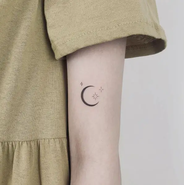 Black shaded tiny 3d moon tattoo on left foot