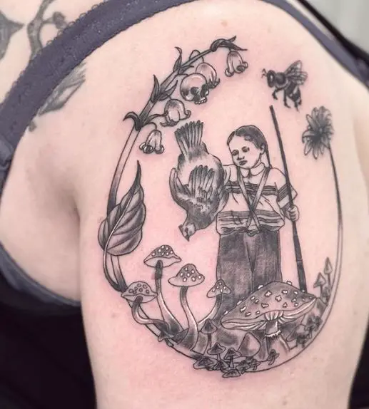 Storybook Style Tattoo with Little Skull Hidden in the Lily of the Valley Florals