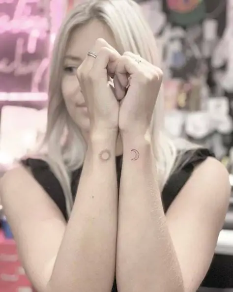 Sun and Crescent Moon Wrist Tattoo