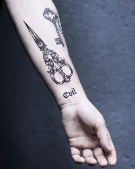 Tattoo Art of Lily of the Valley in a Pair of Scissors