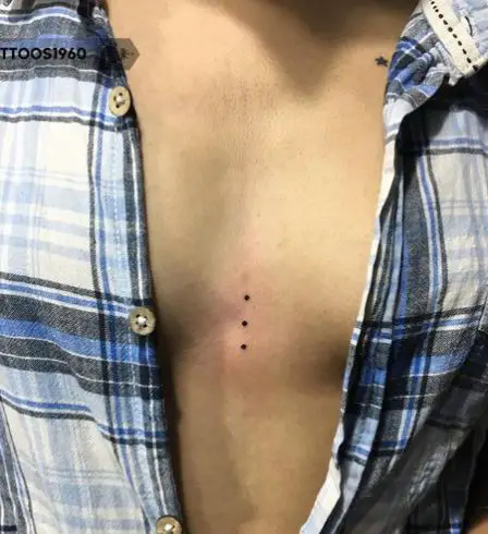 Three Black Dots Tattoo on the Chest