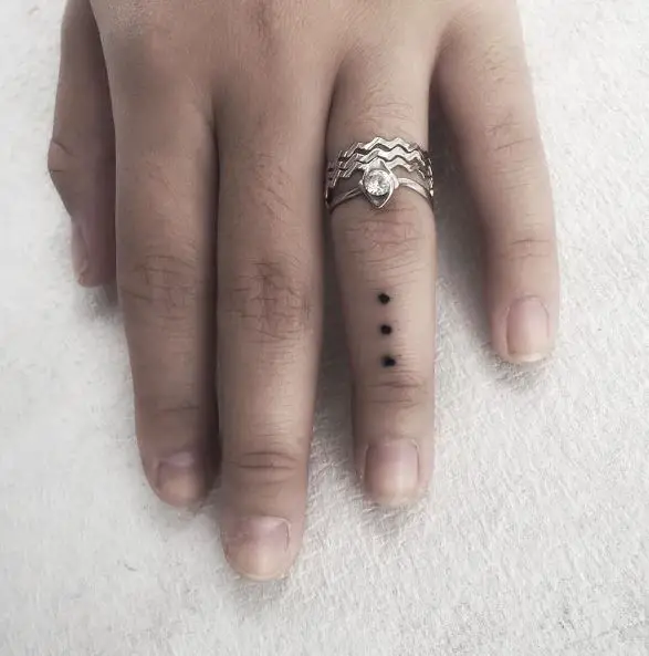Three Dots Tattoo on Ring Finger