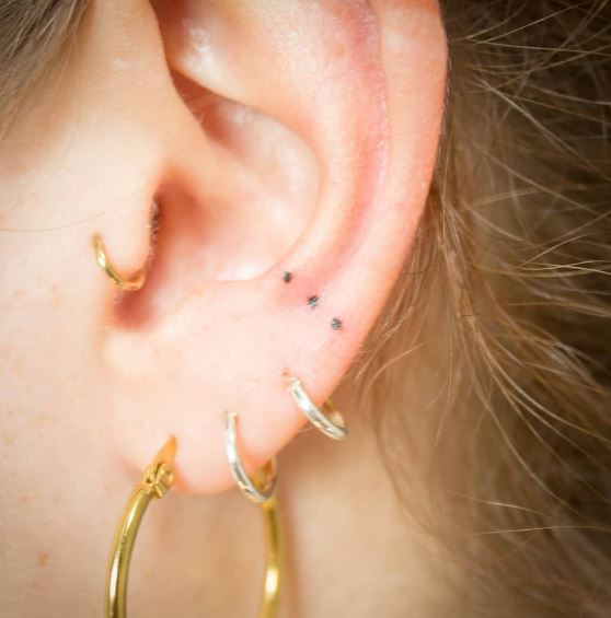 Three Dots Tattoo on the Ear