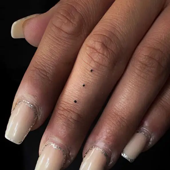 Three Dots Tattoo on the Tall Finger