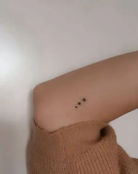 Tiny Black Dots Tattoo