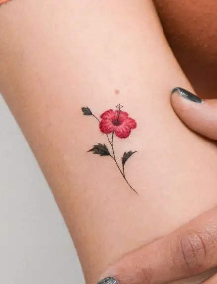 Tiny Red Hibiscus Flower Tattoo