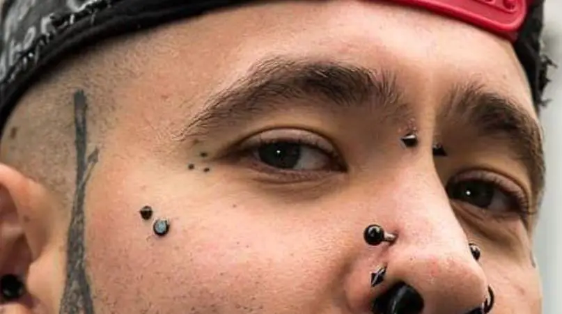 Tiny Three Dots Triangle Tattoo Around the Eye
