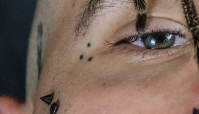 Triangle Three Dot Tattoo Near the Eye