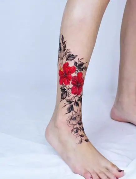 Twin Red Hibiscus Flowers and Black Leaves Tattoo