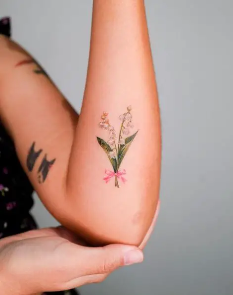 White Lily Green Leaf and Pink Ribbon Floral Tattoo