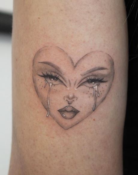 White Tears on Crying Heart Arm Tattoo