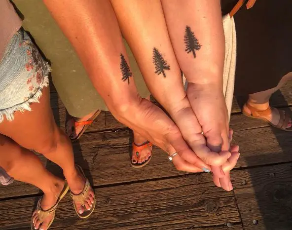 Three Matching Pine Tree Wrist Tattoos