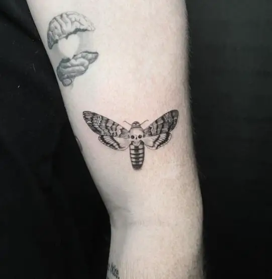 Minimalistic Grey Death Moth Arm Tattoo