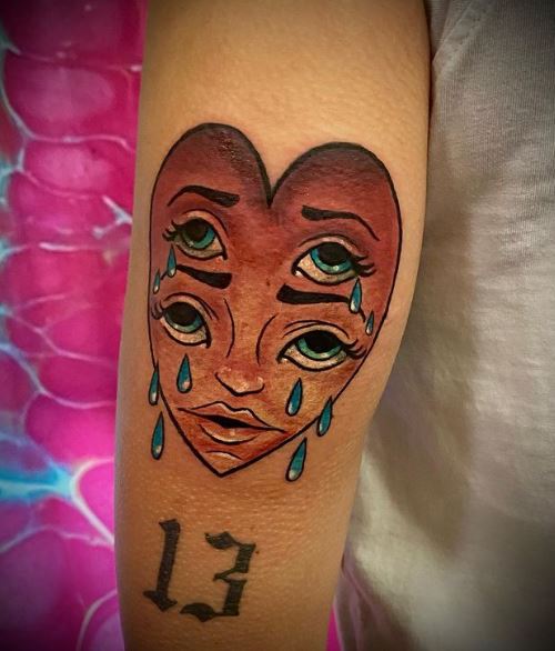 Crying Heart with Two Pairs of Eyes Arm Tattoo