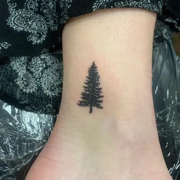 Minimalistic Pine Tree Ankle Tattoo