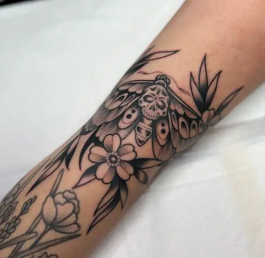 Flowers and Death Moth Forearm Tattoo
