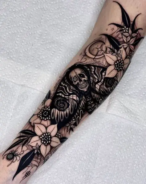 Black Flowers and Death Moth Forearm Tattoo