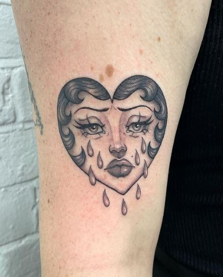Lady Face on Crying Heart Arm Tattoo