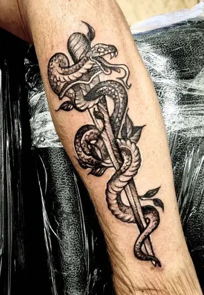 Dagger and Snake Forearm Tattoo