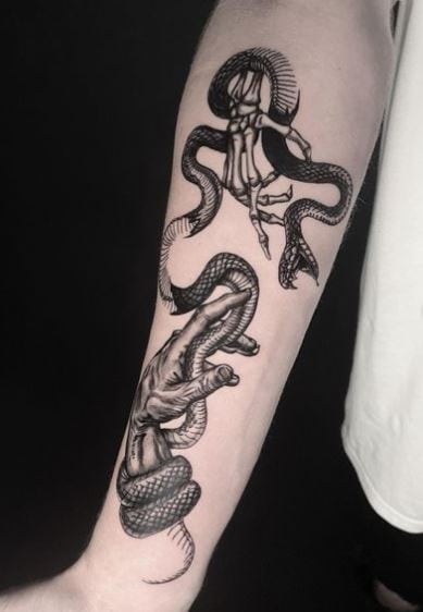 Skeleton Hand and Snake Forearm Tattoo