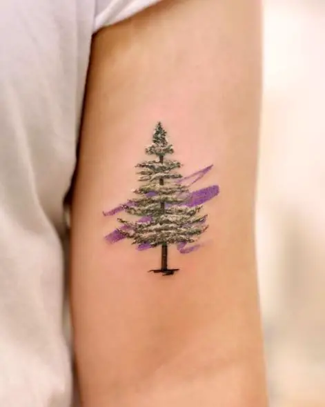 Snow on Pine Tree Biceps Tattoo