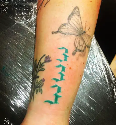 Butterfly and Green 333 Forearm Tattoo