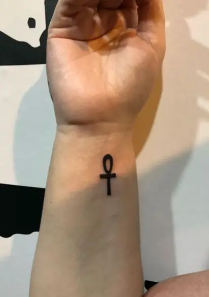 Black Minimalistic Ankh Forearm Tattoo