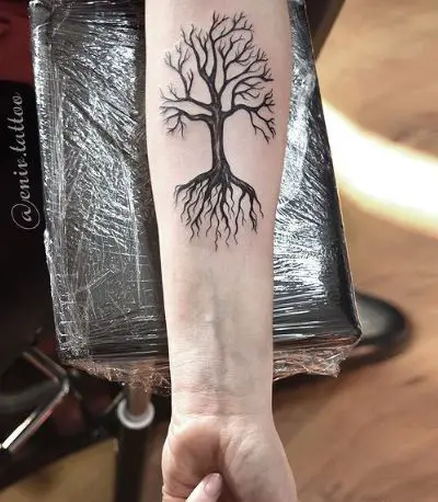 Dark Tree with Roots Forearm Tattoo