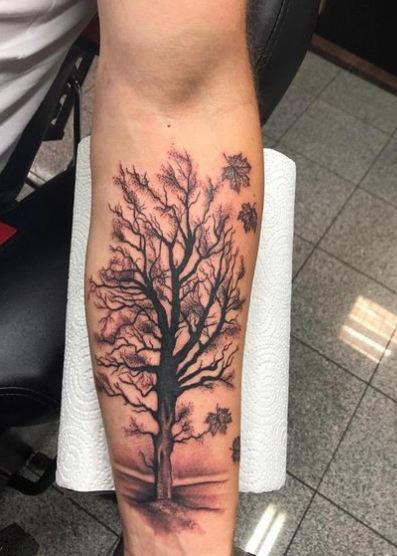 Falling Leaves and Tree Forearm Tattoo